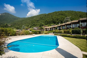 Blue villa with shared pool and private garden near Salo Roe' Volciano